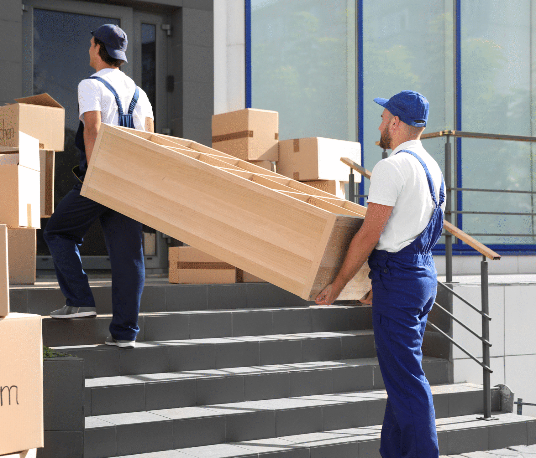 two edmonton movers moving furniture up the stairs