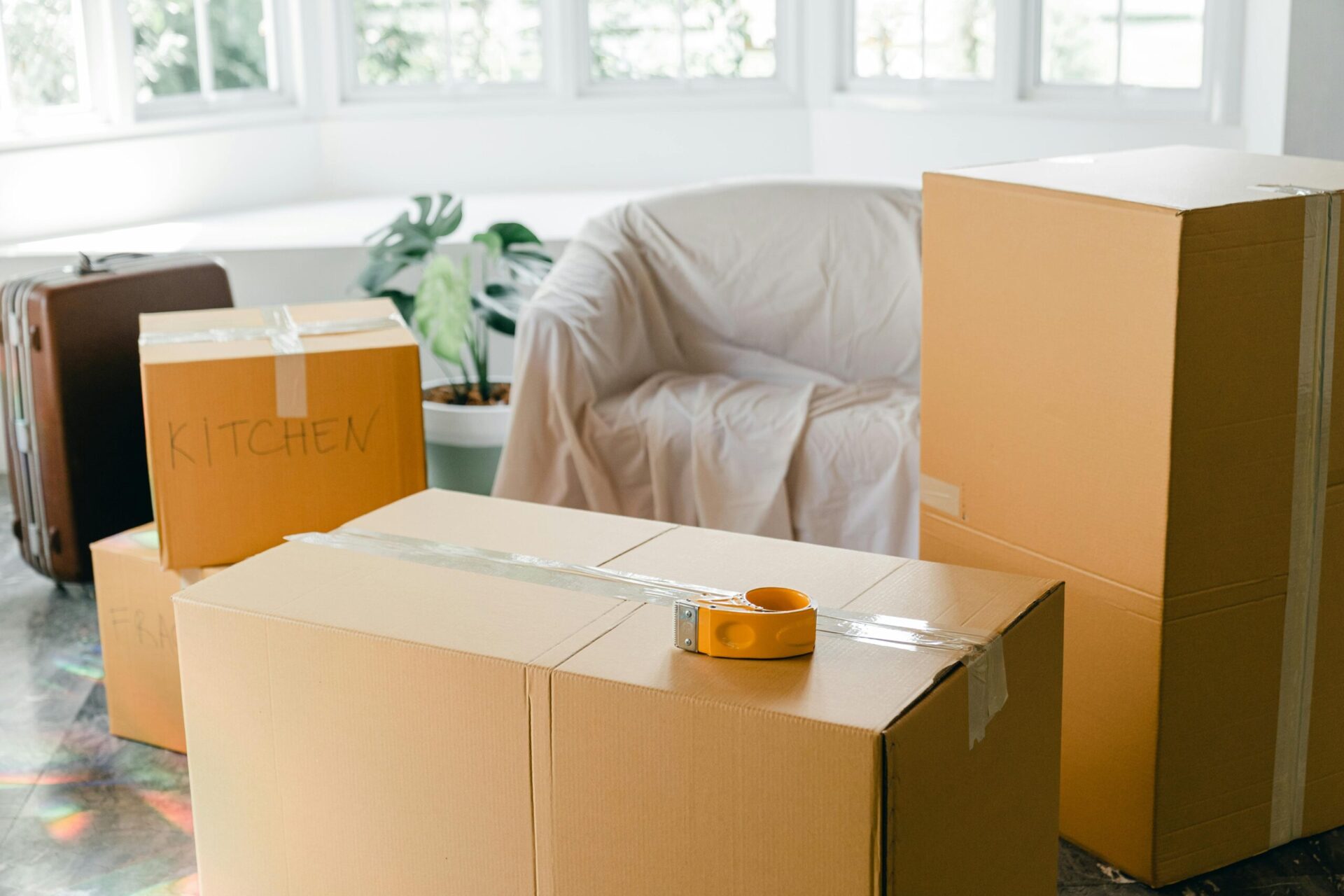 Packing moving boxes with a tape